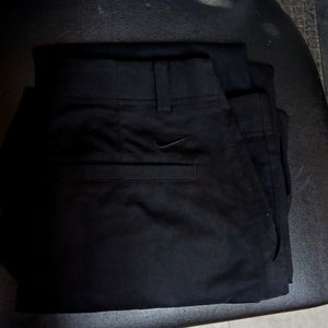 Men's black Nike golf pants.
